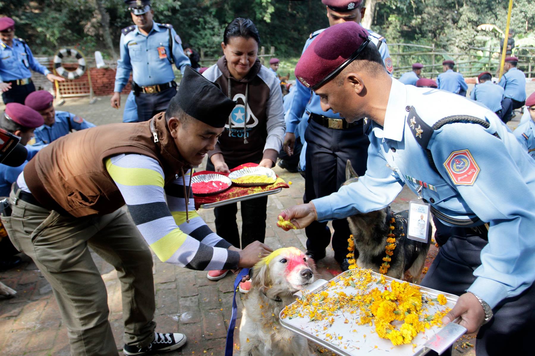 Police-personnel-worshipping-dogs-and-offering-them-garland-and-tika-on-the-occasion-of-Kukur-dog